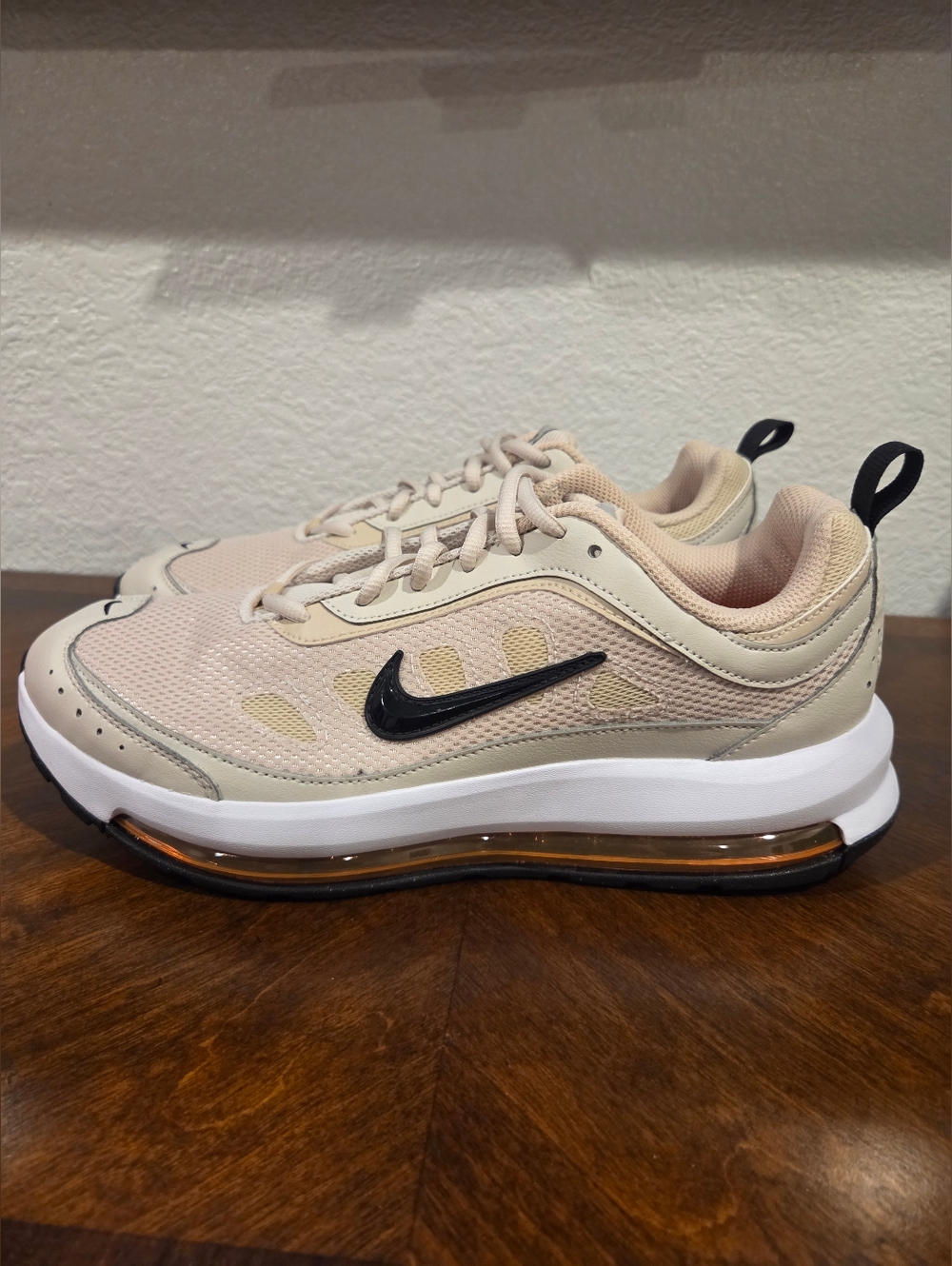 Nike Beige and Black Air Max-style Trainer with Orange Air Unit